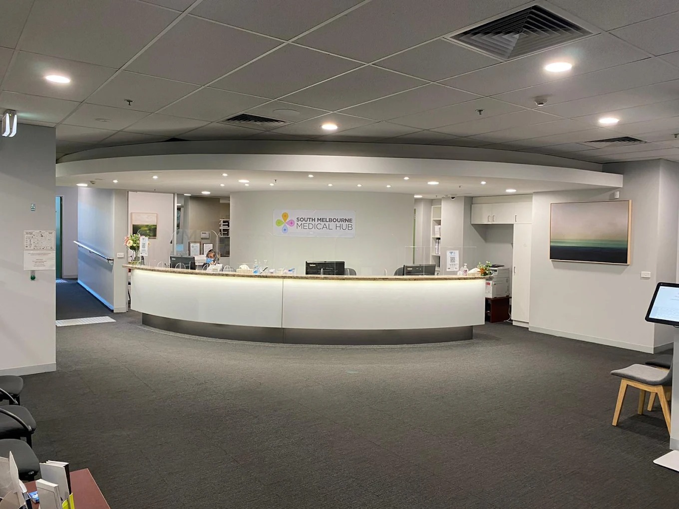 Friendly clinic reception team welcoming patients